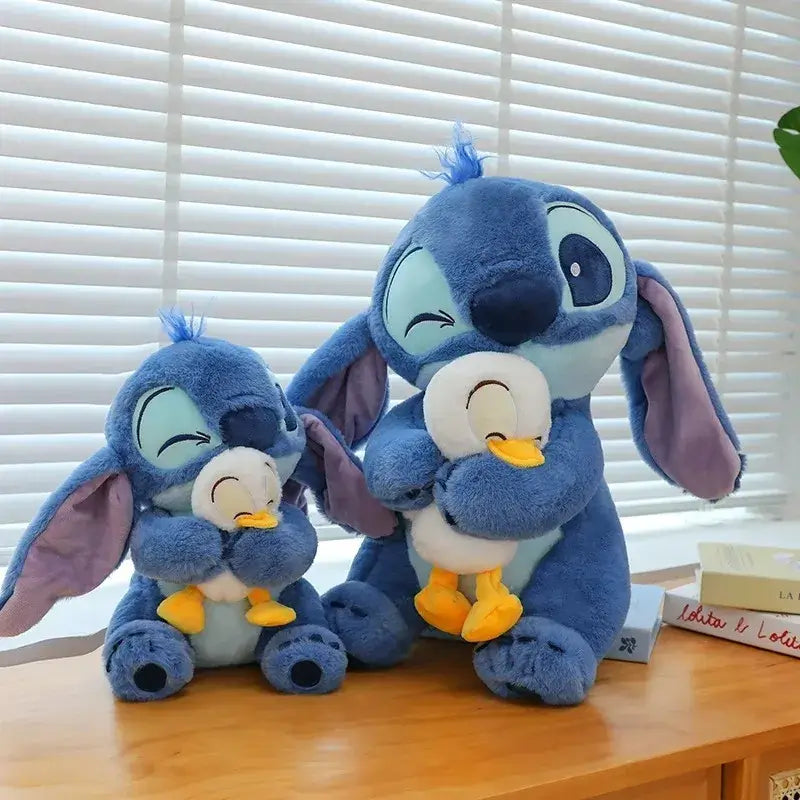 Two Disney Stitch plush dolls with ducks on shelf