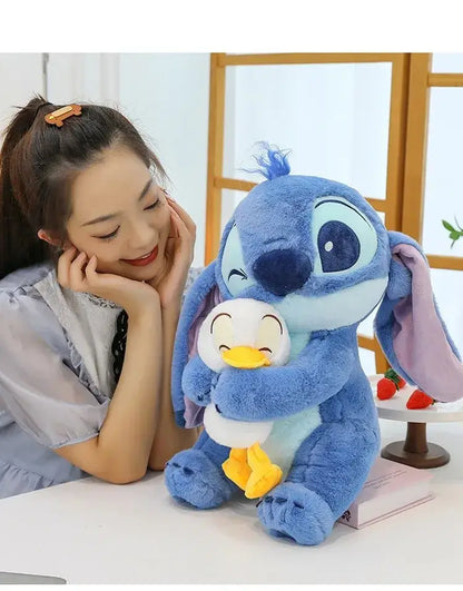 Person admiring Disney Stitch plush doll with duck